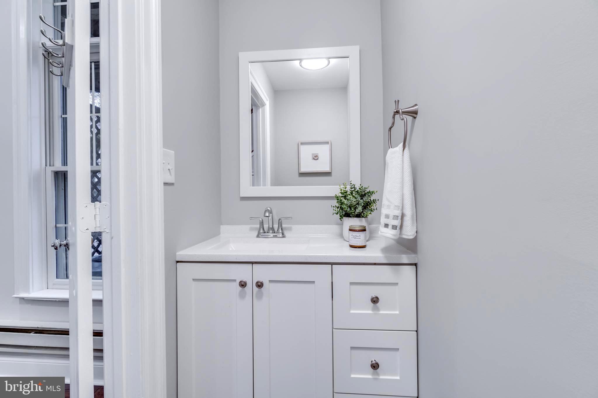 1318 Sundial Drive Reston, VA 20194 - Photo 32 of 52 Half bath vanity at entertainment room