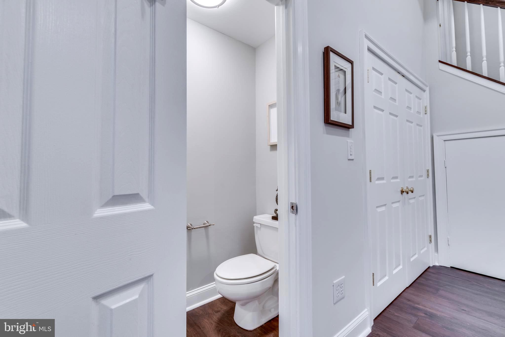 1318 Sundial Drive Reston, VA 20194 - Photo 33 of 52 Half bath view to doors and washer-dryer