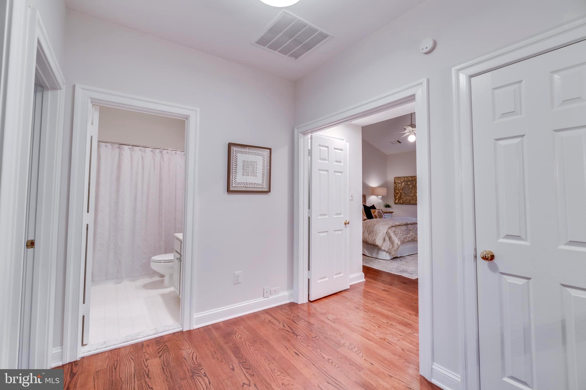 1318 Sundial Drive Reston, VA 20194 - Photo 35 of 52 3rd level, rich oak floors view to hall bath, MBR