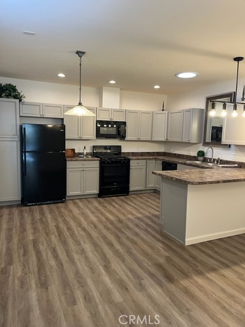 a kitchen with stainless steel appliances kitchen island a refrigerator sink and stove