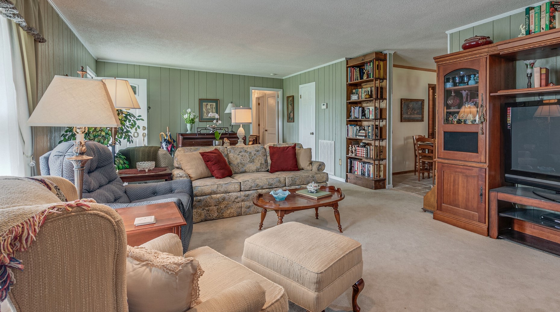 2770 Ben Green Road Lebanon, TN 37090 - Photo 11 of 37 a living room with furniture a rug and a bookshelf