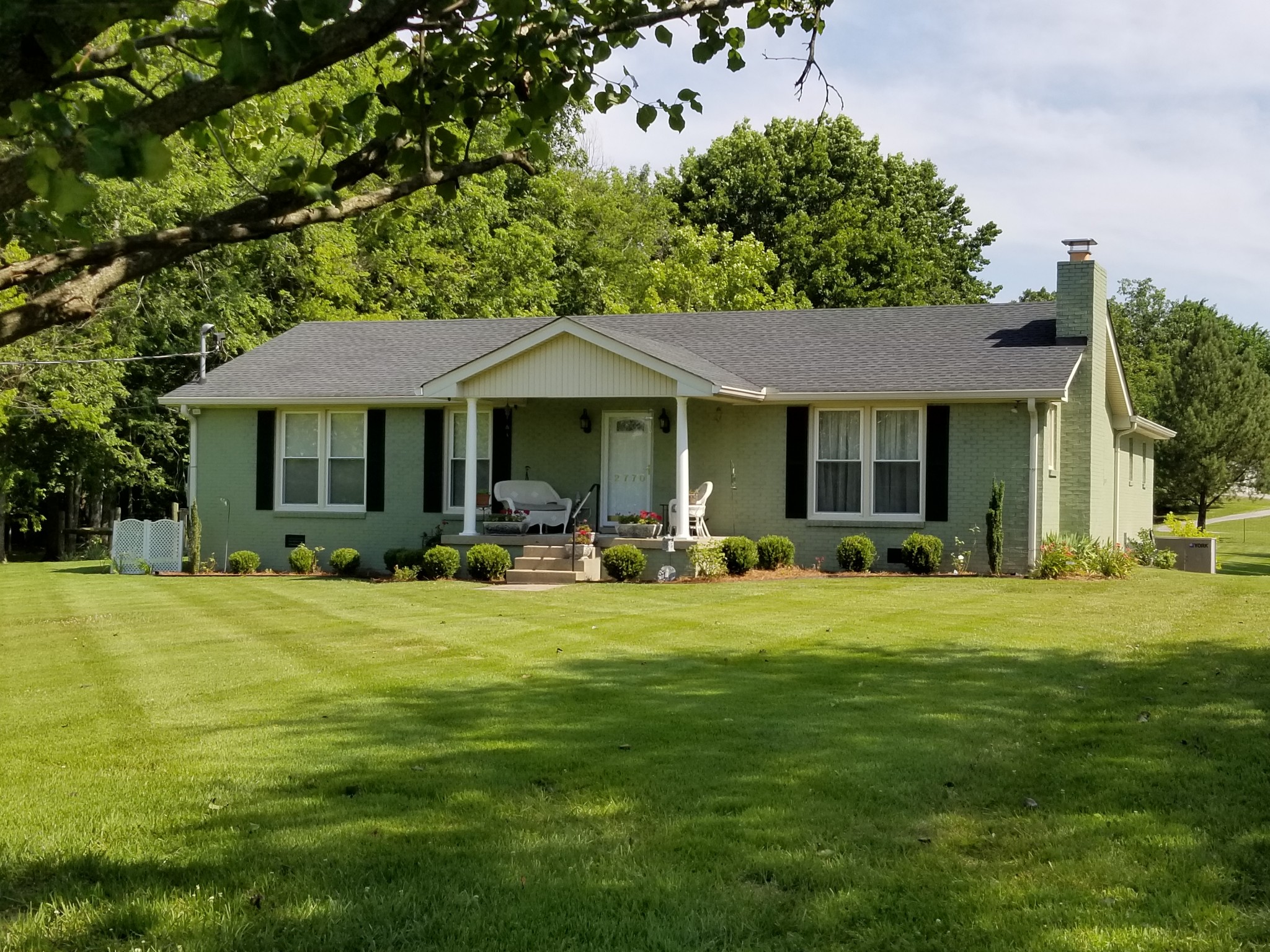 2770 Ben Green Road Lebanon, TN 37090 - Photo 3 of 37 a front view of a house with a garden