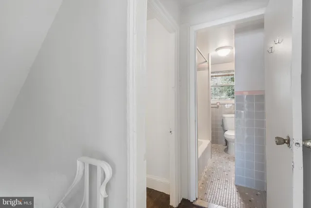 a view of a bathroom from a hallway