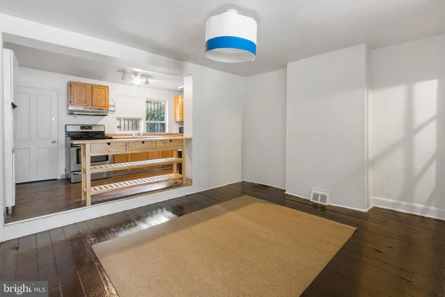 a view of kitchen and wooden floor