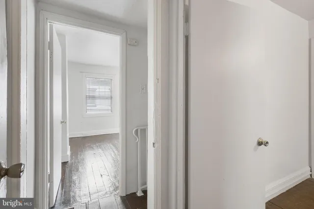 a view of a bathroom from a hallway