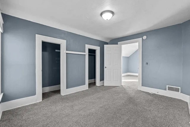 a bench sitting in front of a building