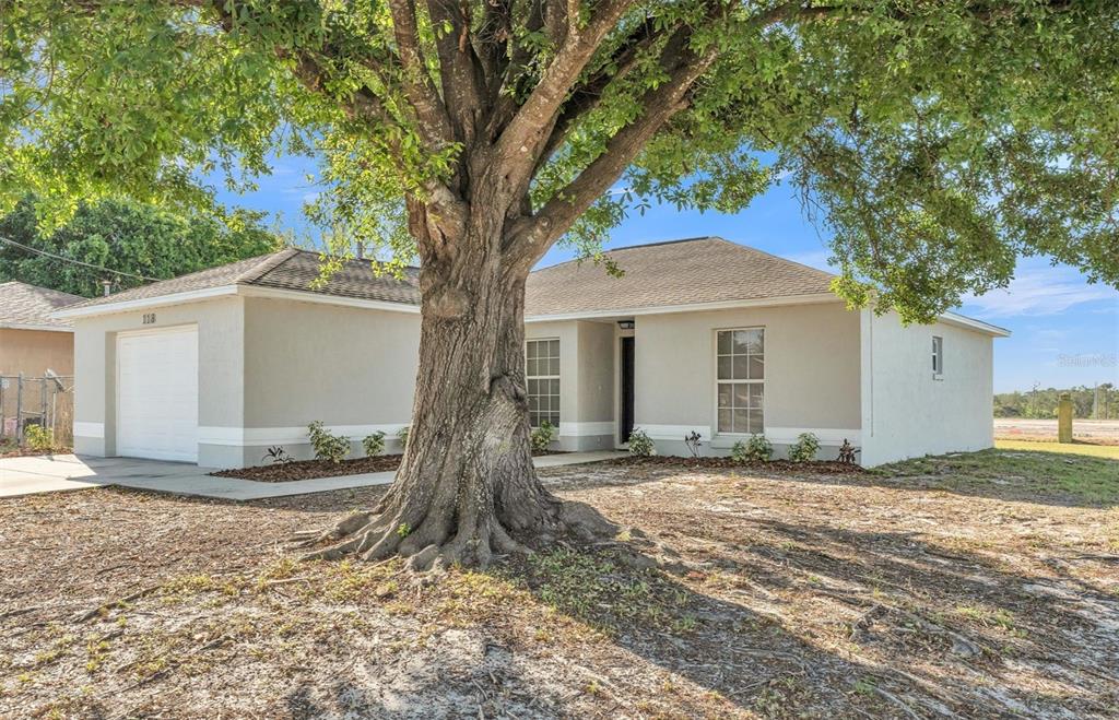 118 Weeping Willow Road Eagle Lake, FL 33839 - Photo 1 of 1 a front view of a house with a yard