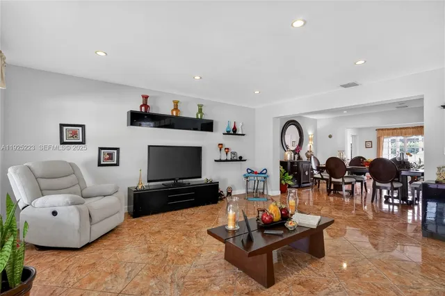 a kitchen with stainless steel appliances granite countertop wooden cabinets a sink and dishwasher