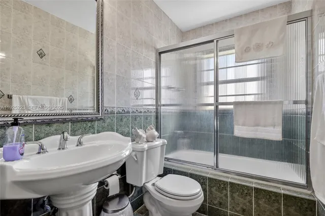 a utility room with sink dryer and washer