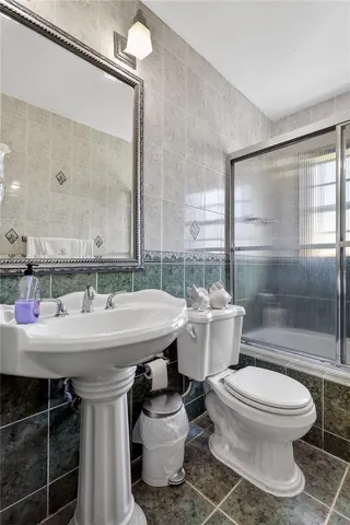 a view of a house with a big yard and potted plants