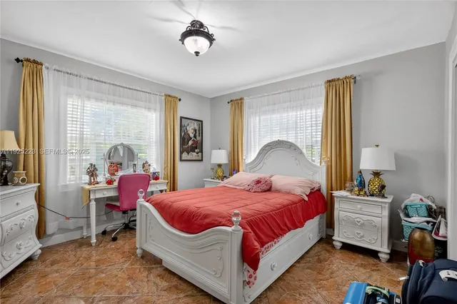 a view of a house with backyard sitting area and garden