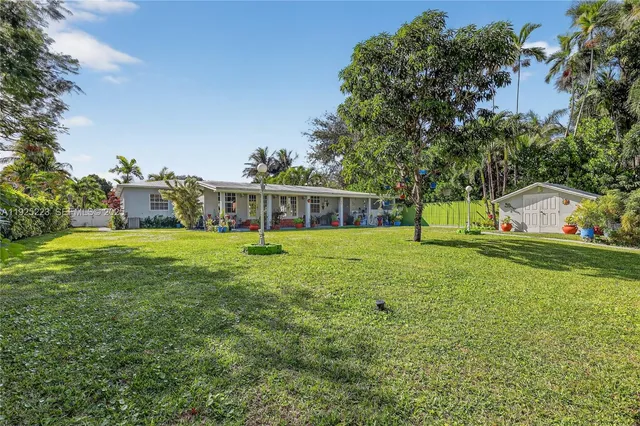 a white refrigerator freezer sitting inside of a kitchen