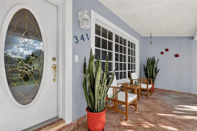 a dining room with furniture and a clock