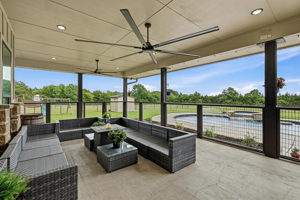 6020 Honeysuckle Road Midlothian, TX 76065 - Photo 25 of 39 Covered patio with concrete flooring, stone column, recessed lighting, and ceiling fans