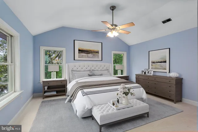 a view of a lake with a house in the background