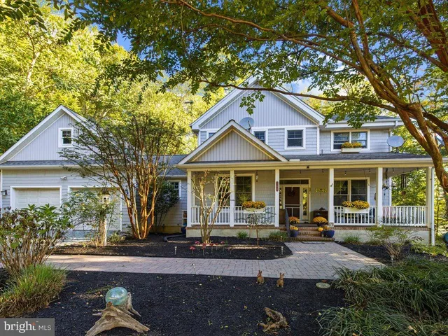 a view of kitchen with wooden floor and electronic appliances