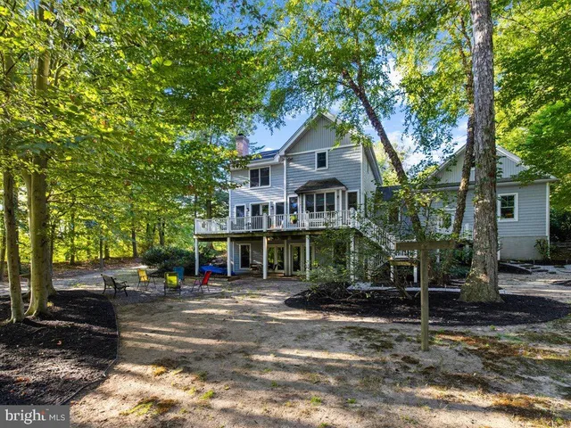 a kitchen with a stove a sink and a window