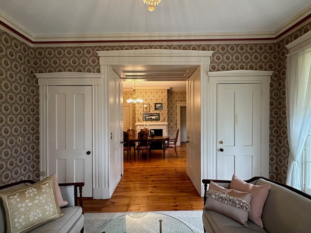 1341 Hardwick Road Hardwick, MA 01037 - Photo 13 of 27 a living room with furniture and a chandelier