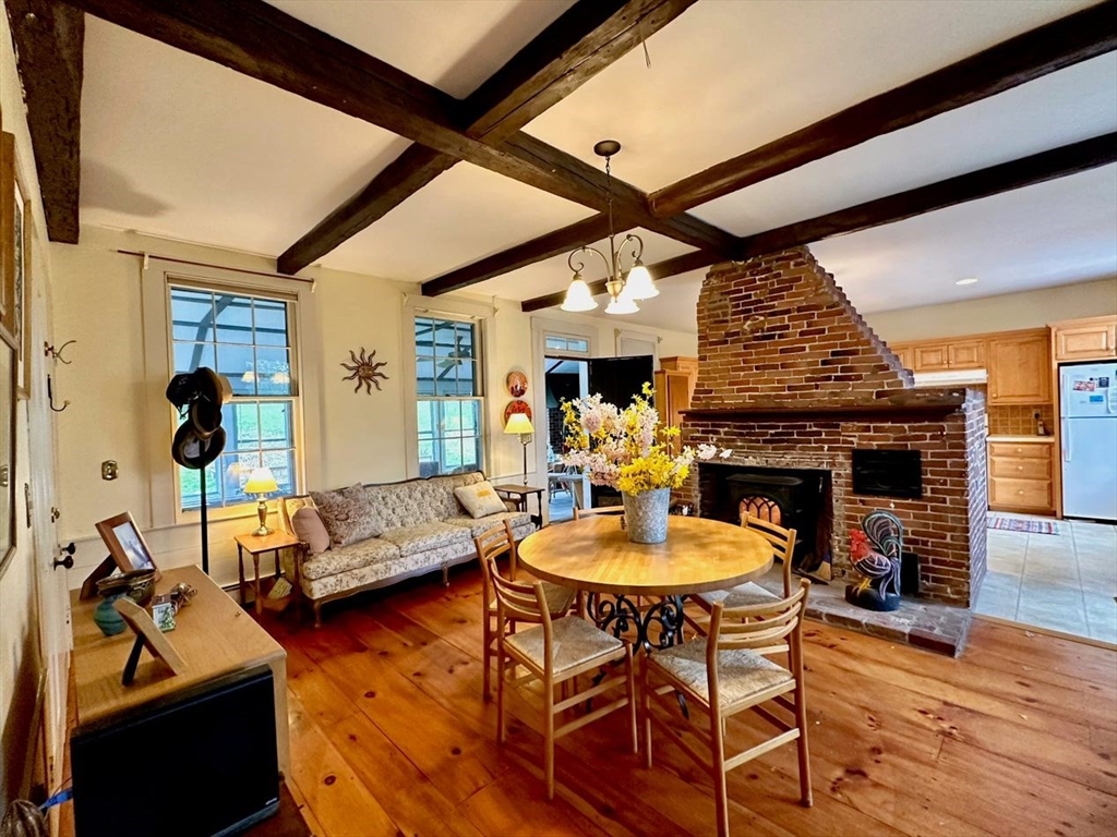 1341 Hardwick Road Hardwick, MA 01037 - Photo 18 of 27 a living room with furniture a fireplace and wooden floor