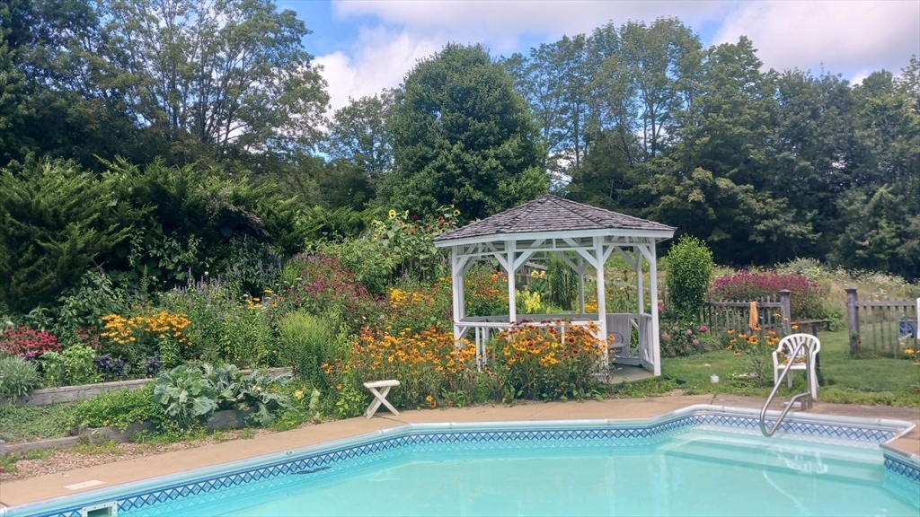 1341 Hardwick Road Hardwick, MA 01037 - Photo 4 of 27 a front view of a house with garden