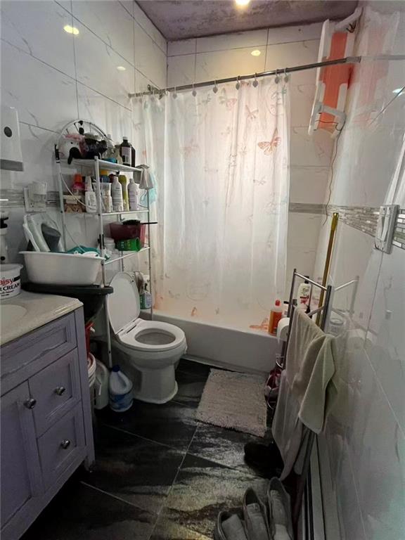 34-37 110th Street Queens, NY 11368 - Photo 7 of 9 a bathroom with a sink toilet and shower