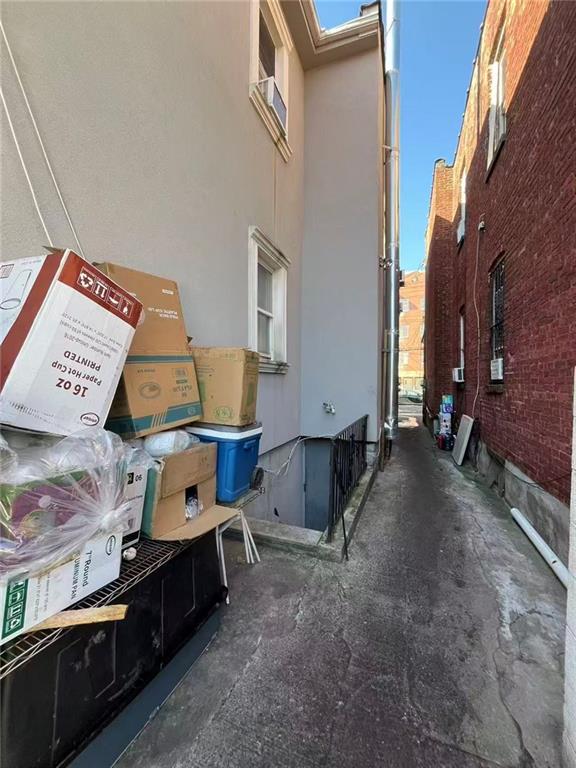 34-37 110th Street Queens, NY 11368 - Photo 8 of 9 a view of a room with furniture and a window