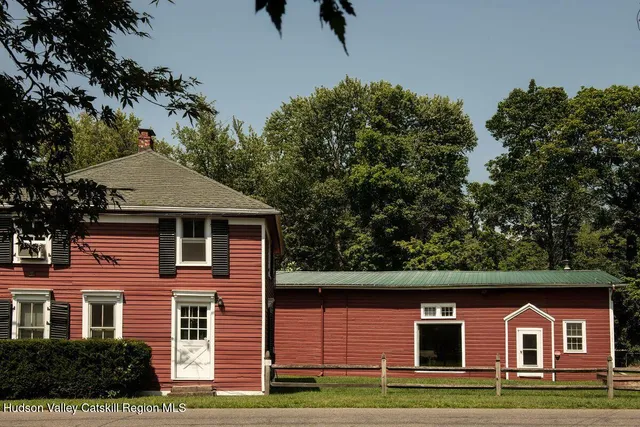 a front view of a house with yard