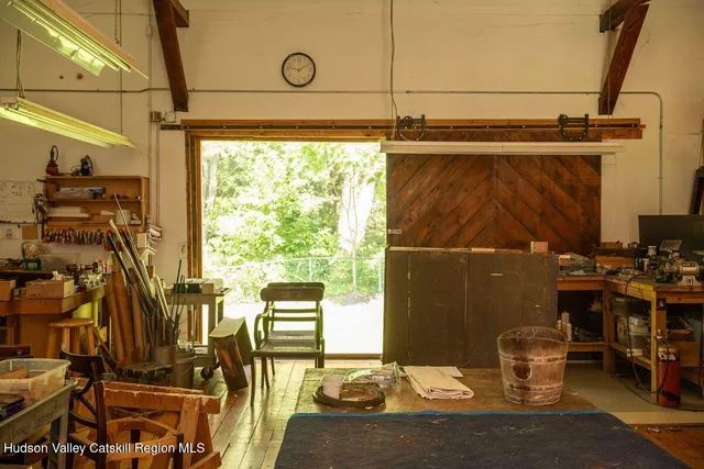 a dining room with furniture and a window