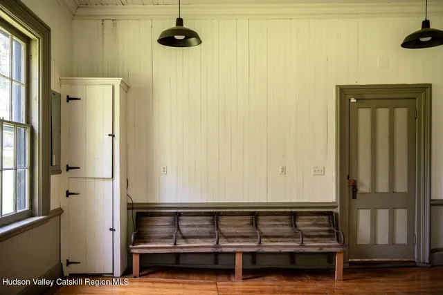 a view of hallway with wooden door