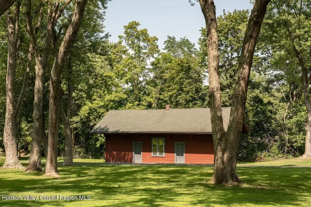 a view of a swimming pool with a yard