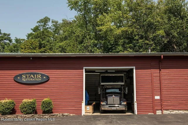 a view of a brick house with a large window