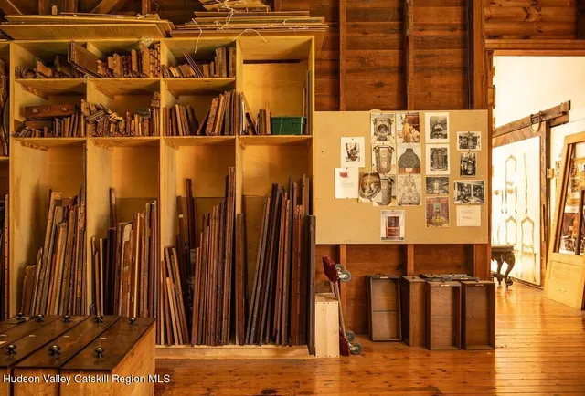 a view of a door with wooden floor and a potted plant