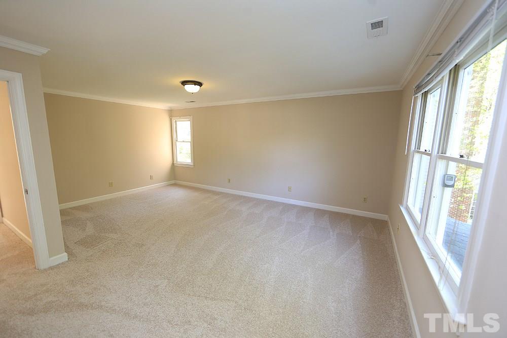 7809 Ketley Court Raleigh, NC 27615 - Photo 17 of 30 Spacious Master Bedroom with fantastic view out back. Brand new carpet upstairs and paint throughout home!
