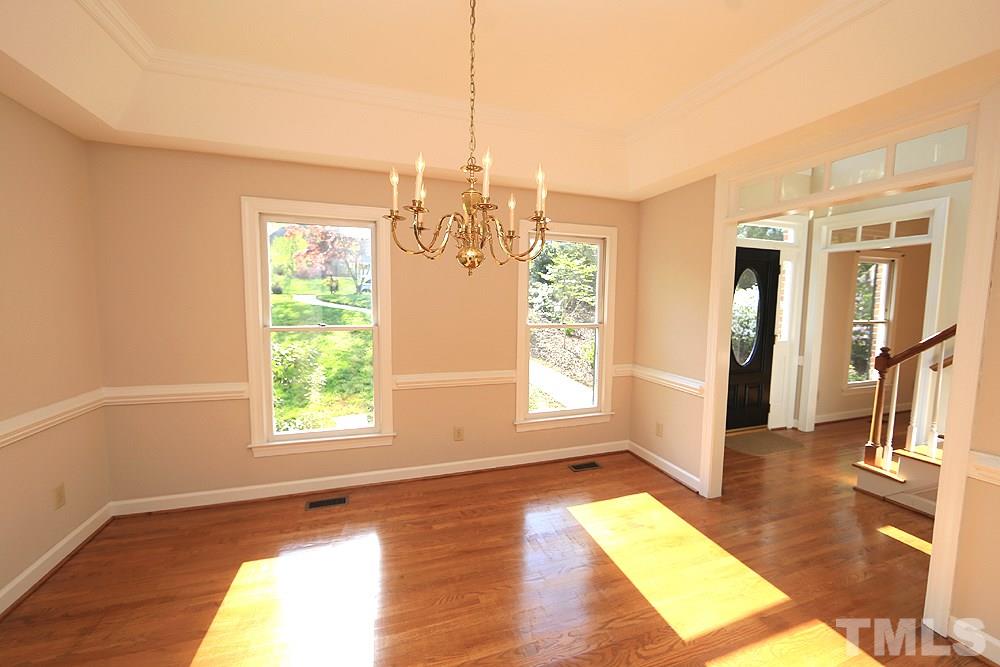 7809 Ketley Court Raleigh, NC 27615 - Photo 6 of 30 Wonderful sunlight throughout the home and lovely transom windows to bring in as much as possible.