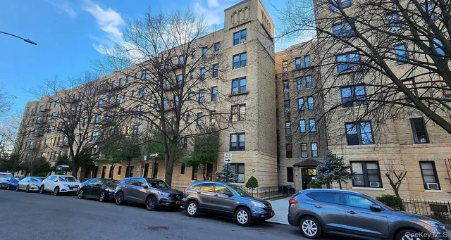 a view of cars parked in front of a building