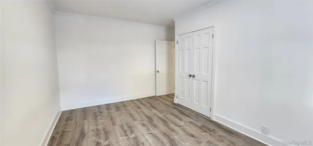 wooden floor in a white room