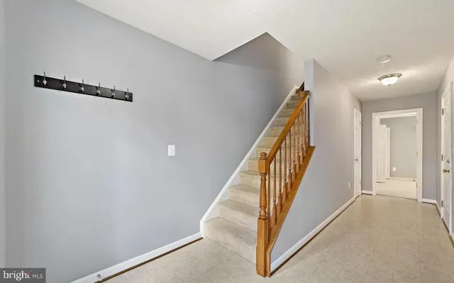 a view of a hallway with staircase