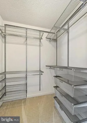 a bathroom with a shower and a glass door