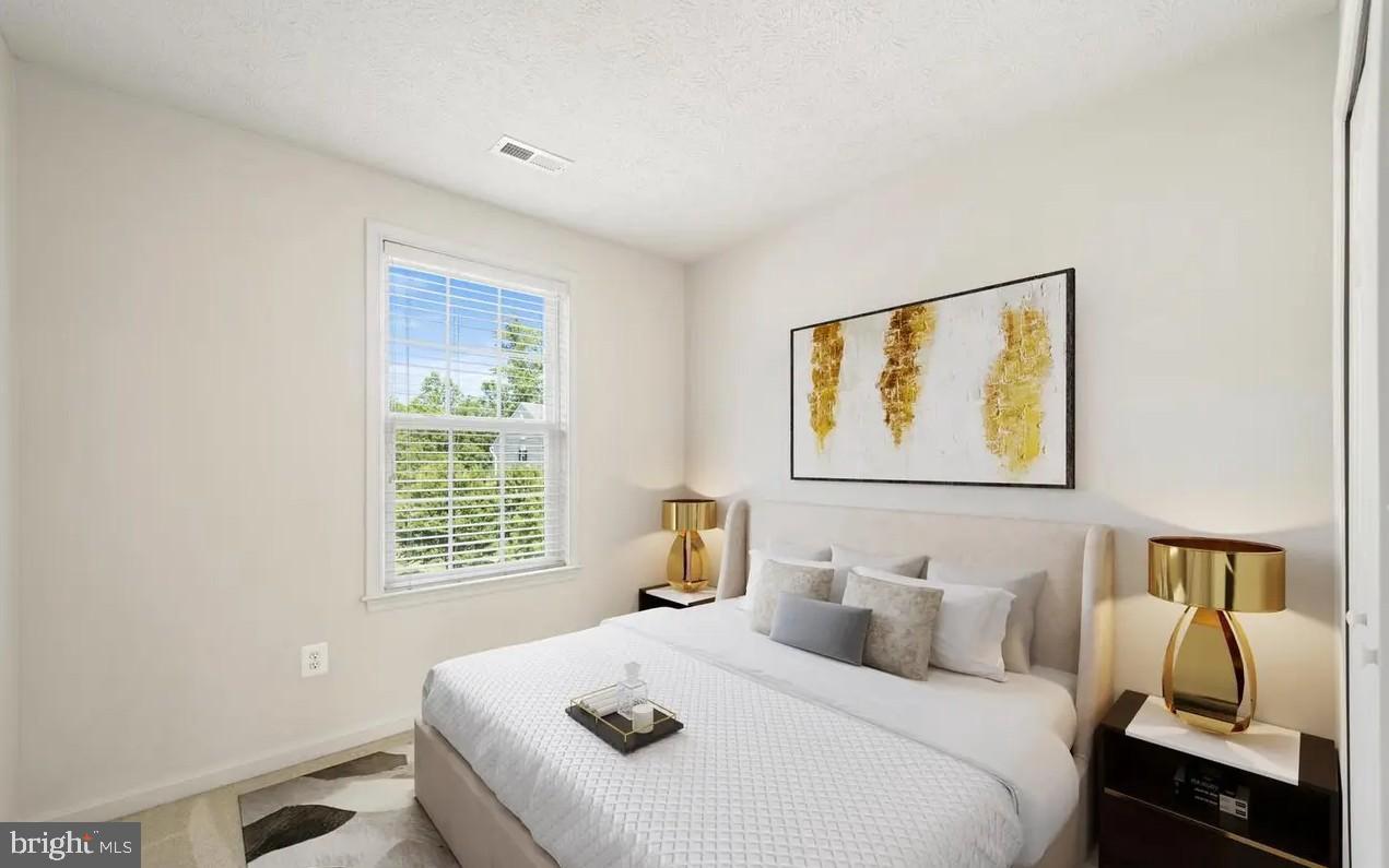 114 Compass Cove Stafford, VA 22554 - Photo 2 of 15 a bedroom with a bed and wooden floor