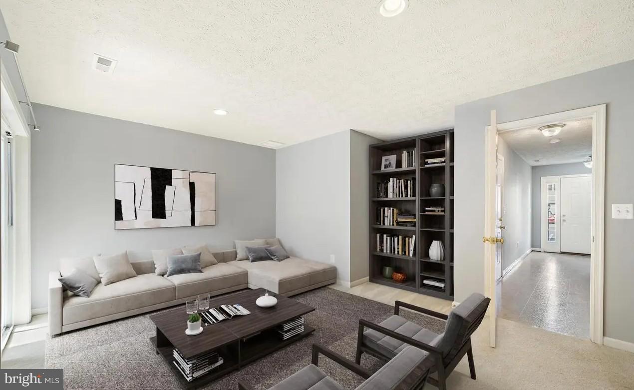 114 Compass Cove Stafford, VA 22554 - Photo 6 of 15 a living room with furniture and a book shelf