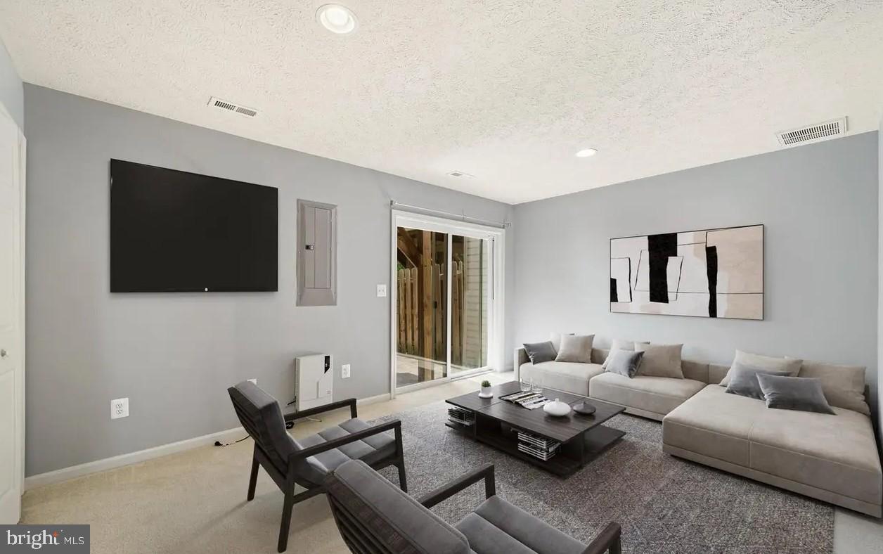 114 Compass Cove Stafford, VA 22554 - Photo 7 of 15 a living room with furniture and a flat screen tv