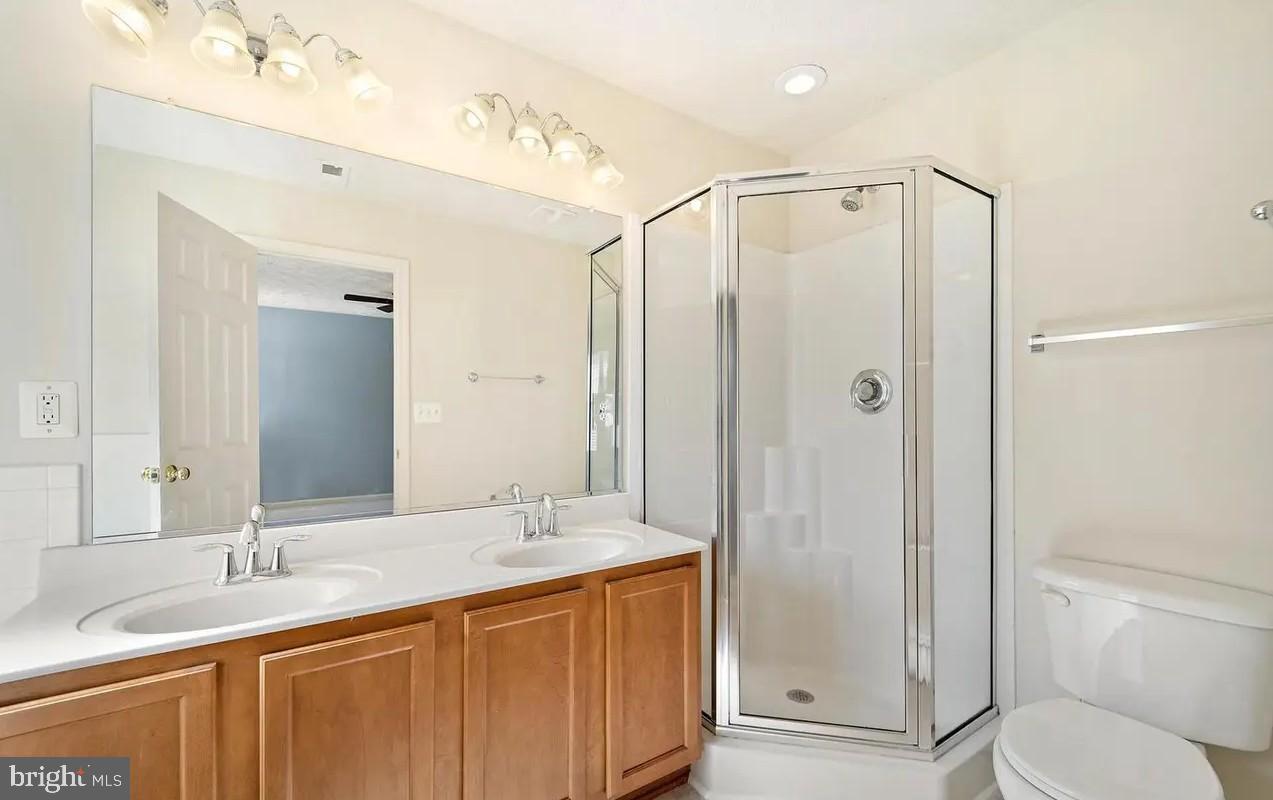114 Compass Cove Stafford, VA 22554 - Photo 9 of 15 a bathroom with a granite countertop sink toilet and shower