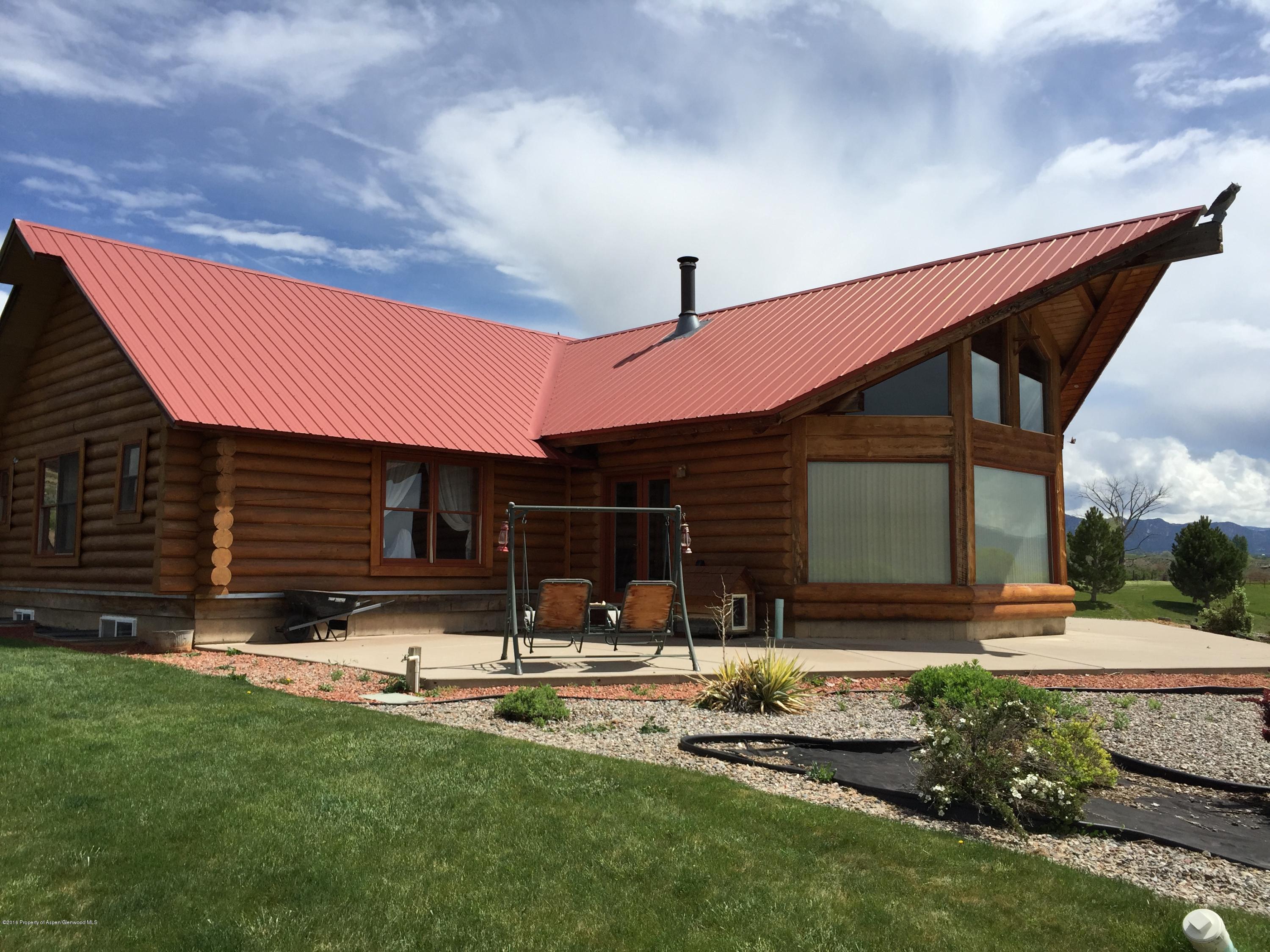 1977 County Road 210 Rifle, CO 81650 - Photo 1 of 16 a front view of house with yard and green space
