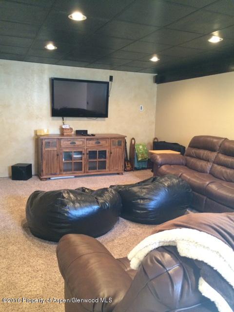 1977 County Road 210 Rifle, CO 81650 - Photo 13 of 16 a living room with furniture and a flat screen tv