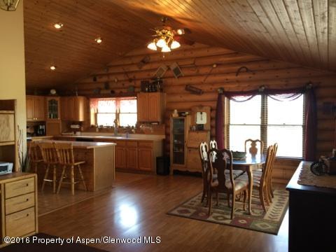 1977 County Road 210 Rifle, CO 81650 - Photo 5 of 16 a view of a dining room with furniture window and outside view