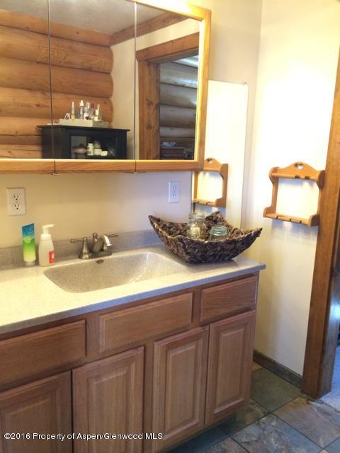 1977 County Road 210 Rifle, CO 81650 - Photo 10 of 16 a bathroom with a sink and a mirror