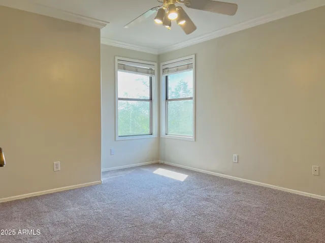 an empty room with a empty space and windows