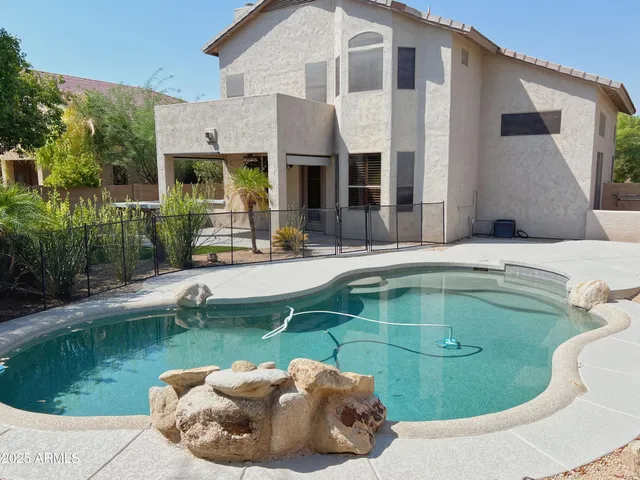 a swimming pool with outdoor seating yard and outdoor seating