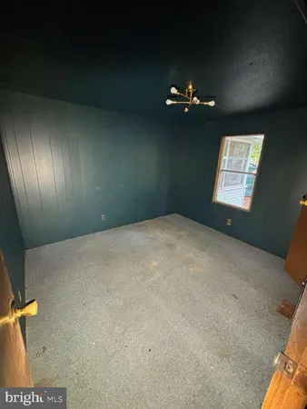 a view of empty room with windows