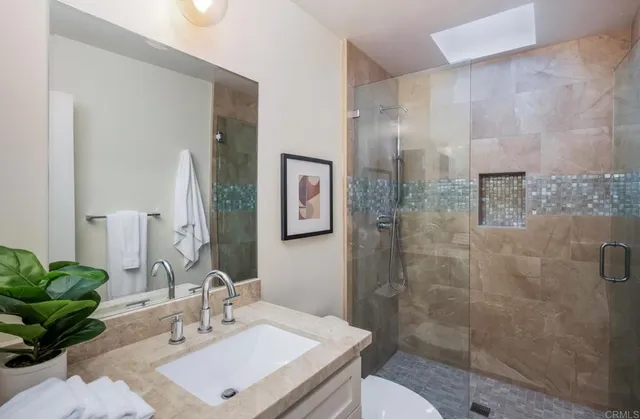 an empty room with closet and bathroom